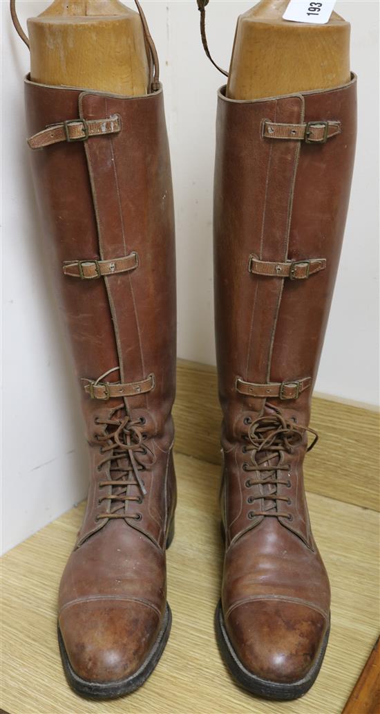 A pair of mens leather riding boots and trees